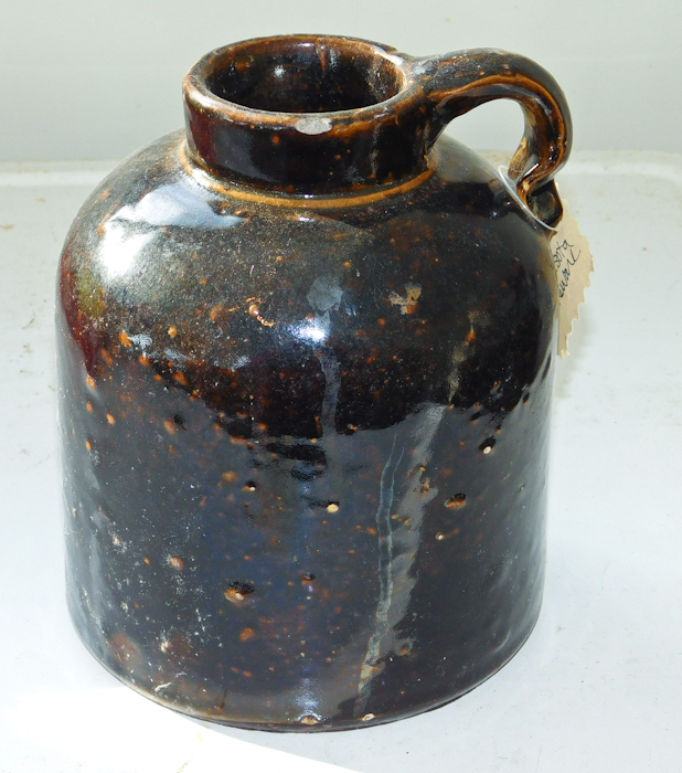 lot 49 image: Red Wing Minnesota Stoneware Co. dark brown glaze jug