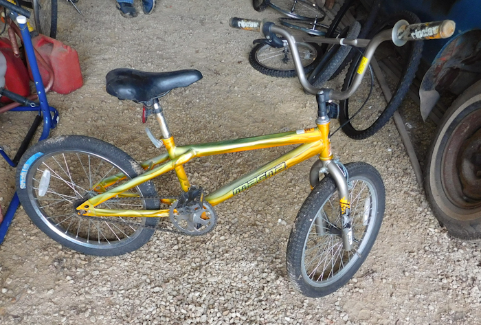 lot 28 image: four bicycles and assorted wheels and tires please see photos