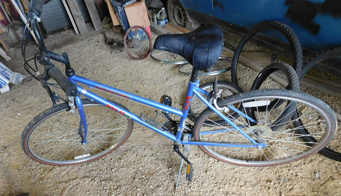 lot 29 image: four bicycles and assorted wheels and tires please see photos