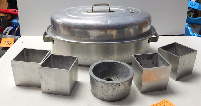lot 203 image: aluminum bakeware and candle holders , empty