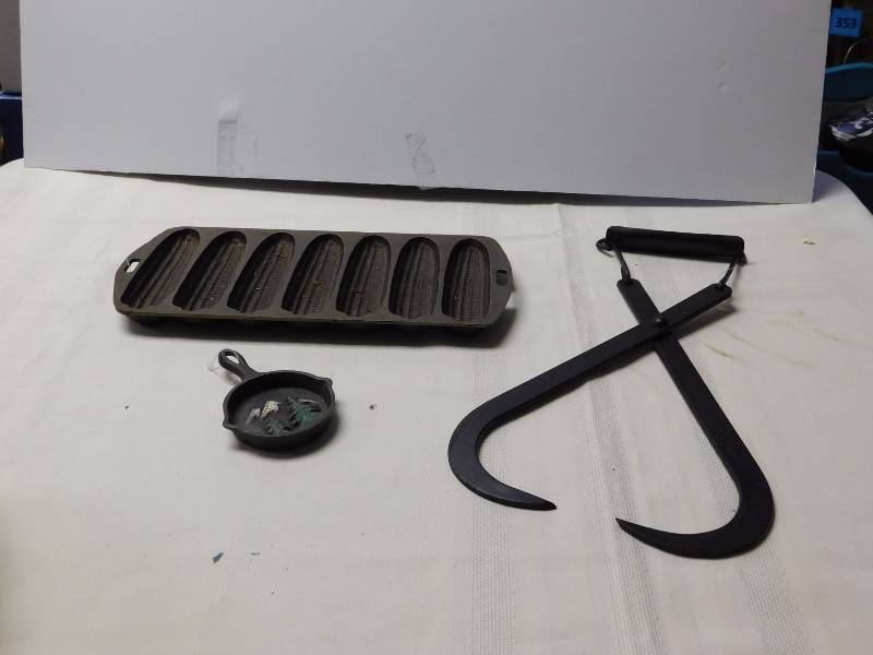lot 190 image: Vintage cast iron corn bread pan, metal ice hook & more