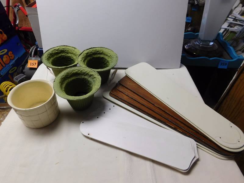 lot 195 image: Haeger planter pot 5119, three watertight fiber urns several blades
