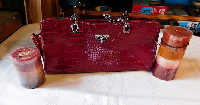 lot 279 image: prada red purse and candles please see photos and inspect