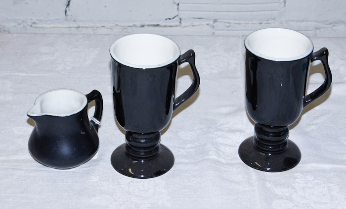 lot 27 image: two black Hall mugs 1272 and a black creamer pitcher