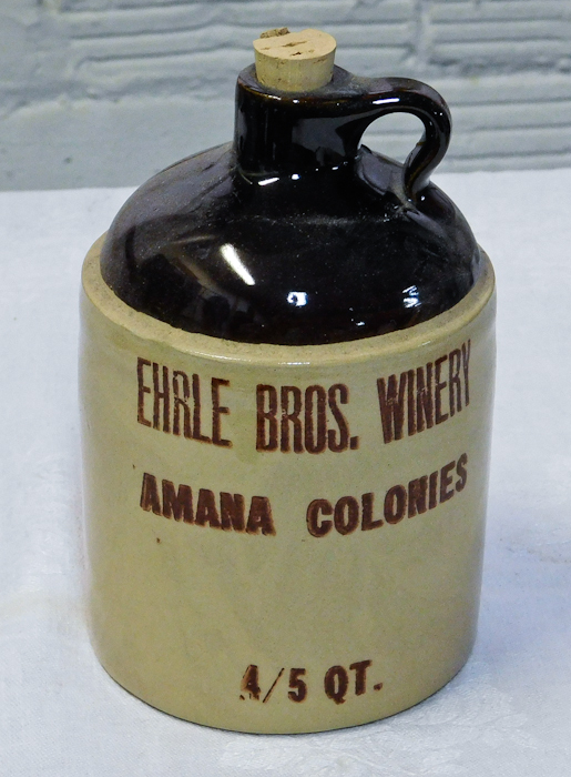 lot 37 image: vintage crock & brown glaze jug advertising.
