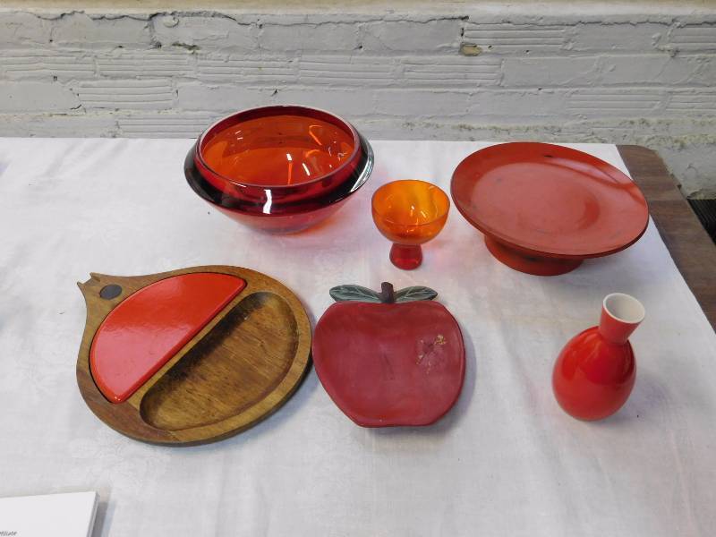 lot 82 image: several vintage red glass and red ceramic decorative serving items.