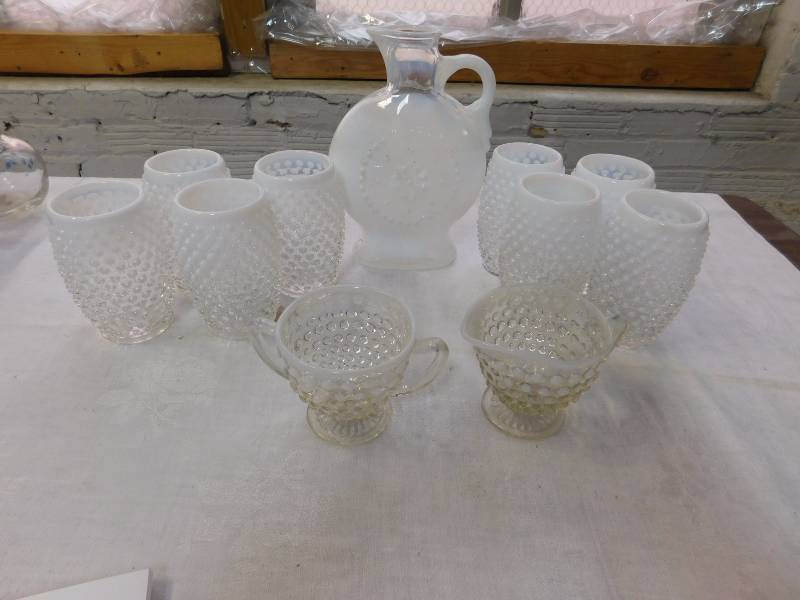 lot 100 image: 8 Handblown hobnail milk glasses and pitcher and creamer with sugar