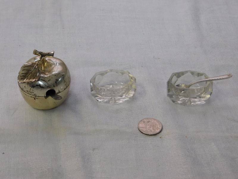 lot 101 image: cut glass salt cellars with one spoon and silver plate apple with sterling spoon
