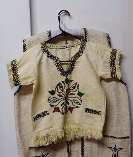 lot 126 image: 1 child size and 1 adult size Middle Eastern or North African mens folk dress
