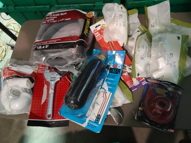 lot 118 image: NEW Large Lot Plumbing Items incl. Harveys Clog Buster for 4-6 Drains, Slip Nut Wrench, Drain Wrench, Discharge Hoses and MUCH MORE