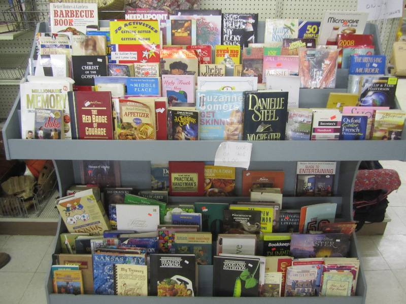 lot 445 image: Book display filled with books...