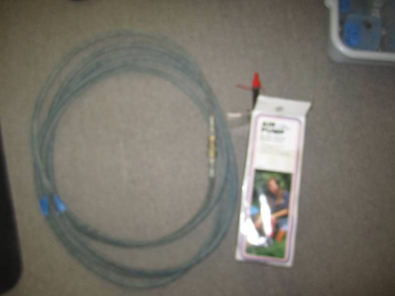 lot 517 image: Heavy air hose and hand pump...
