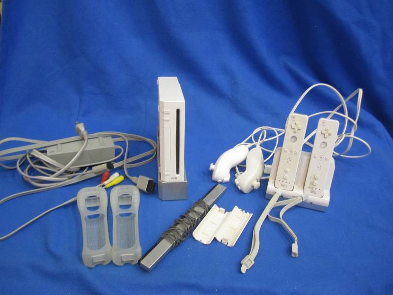 lot 12 image: Wii, 2 controlers with cases, and 2...