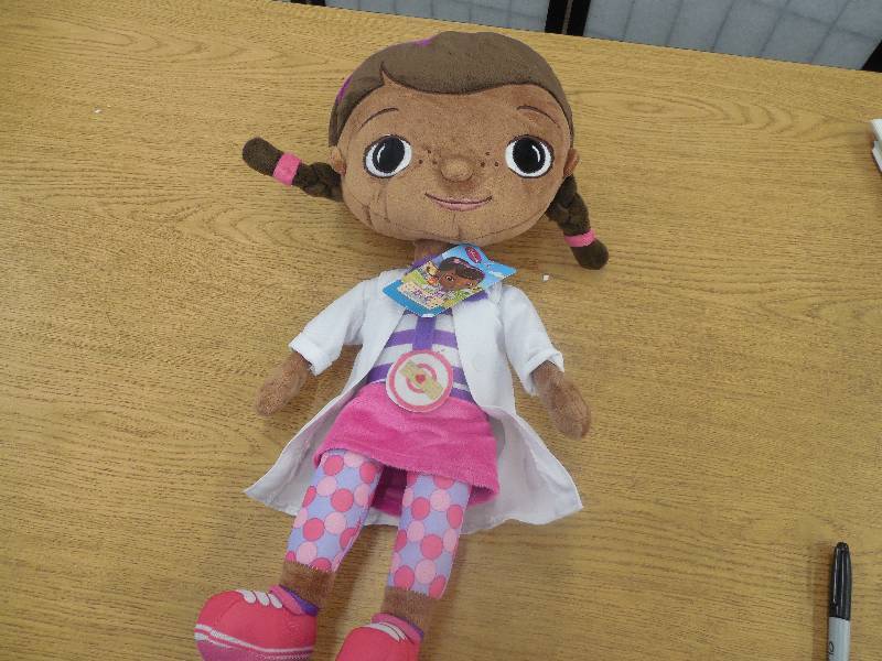 lot 35 image: Disney Doc McStuffins Shaped Pillow
