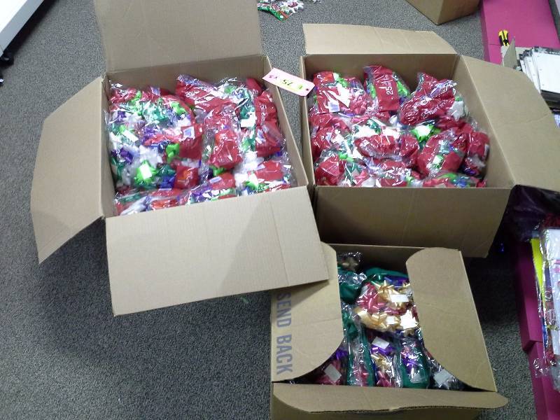 Three large boxes of Christmas bows