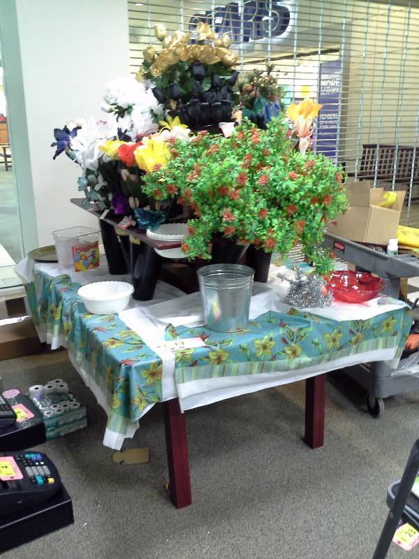 Floral display two tiered table with contents