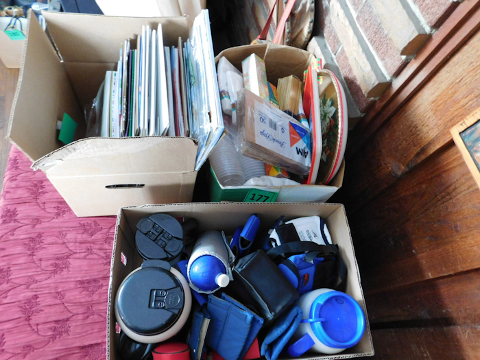 lot 177 image: several boxes for gift giving paper napkins drink koozies and more