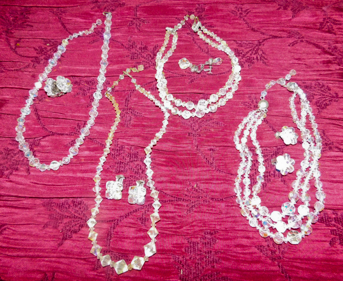 lot 57 image: 4 necklaces each with a pair of matching earrings