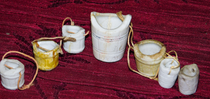 lot 114 image: thimbles and a group of water well pail thimbles