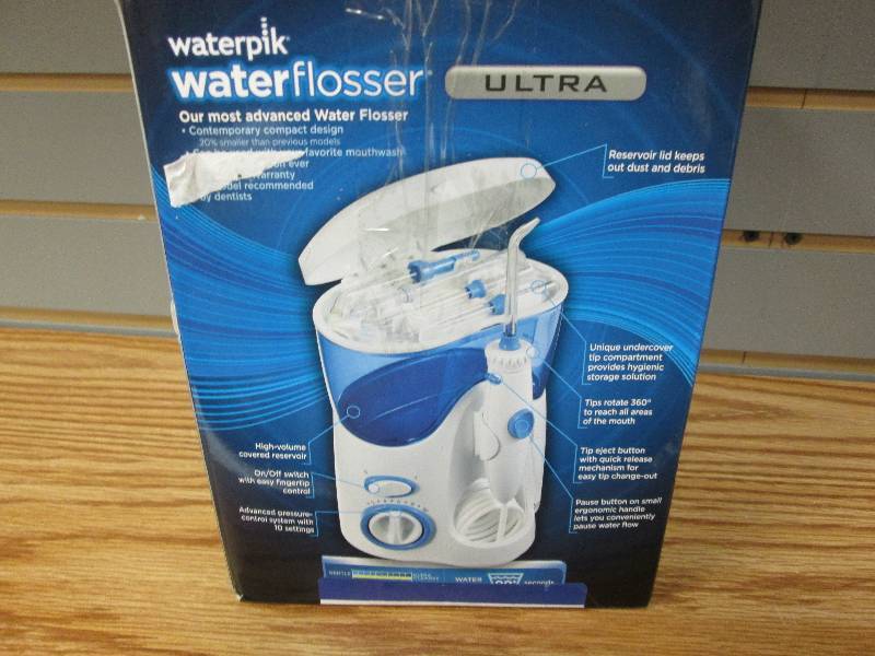 lot 24 image: Waterpik Water Flosser Ultra  WP-10...