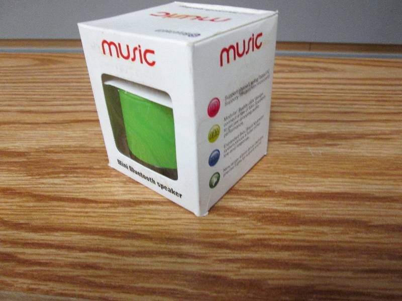lot 74 image: Music mini bluetooth speaker green...
