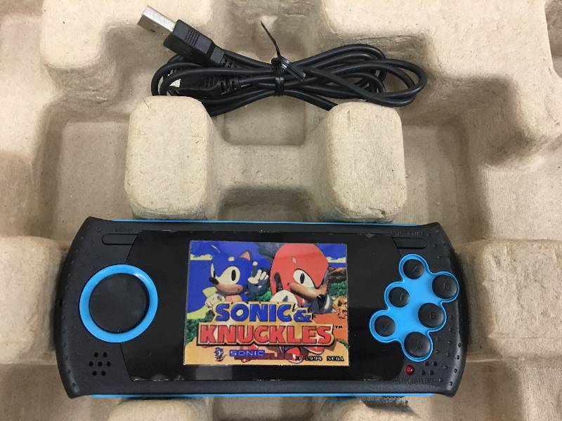 lot 87 image: Sega Genesis Ultimate Portable Game Player retail $99