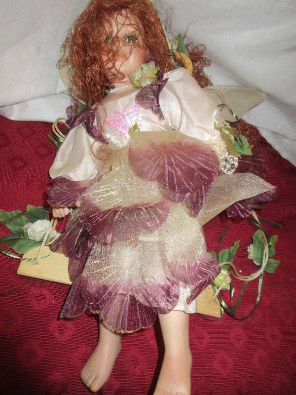 lot 62 image: COLLECTIBLE PORCELIAN FAIRY DOLL