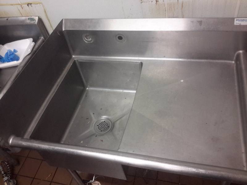 lot 7 image: Stainless Steel Sink.. 40 12 in w x 29 12 in d x 41 in to top of back splash.. NSF  Sink  18 in x 24in x 10 in deep.    Has drain closling lever.