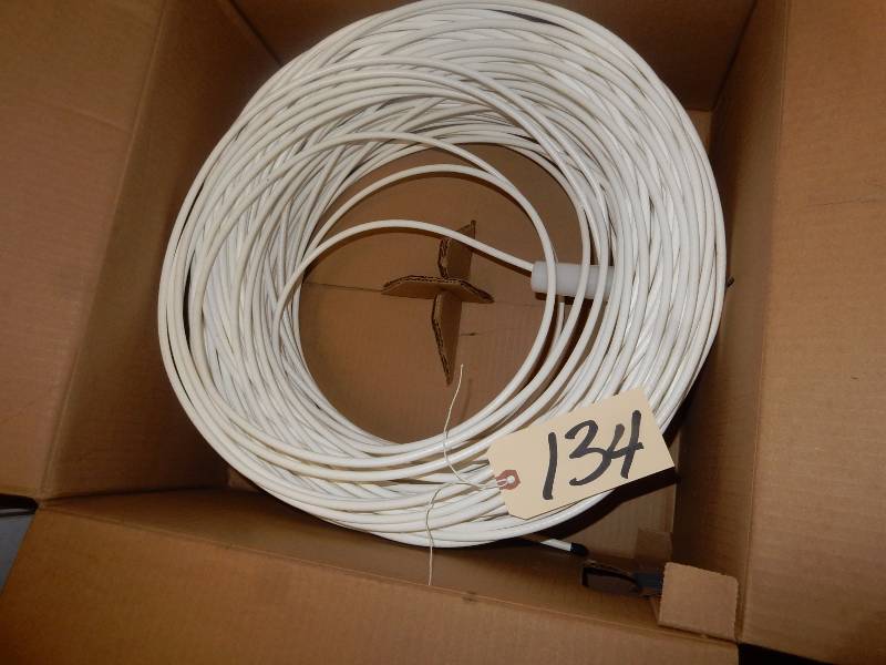 lot 134 image: Partial box of Coaxil cable.. Original 1000 ft.. Looks like over 12 there.