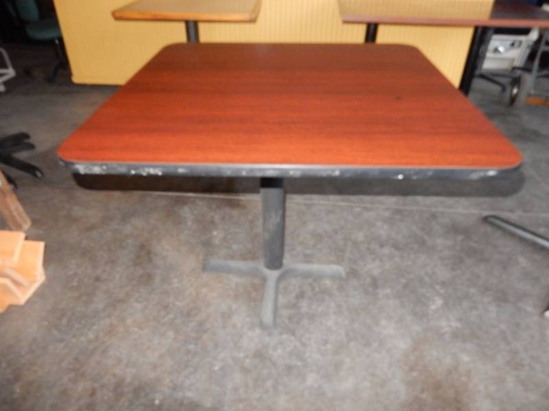 lot 171 image: Cherry Wood Venere  and black edge Table with one pedestal.  36in x 36in x 29 in.  This is an example.. All have some scratches but none real bad.