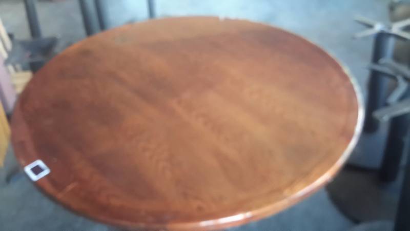 lot 217 image: Solid Wood, Cherry Finish Round Table.. 60 in w x 29 in h.. Very solid Steel base with 5 pillarssupports.. Very heavy.. Bring your own loading help.. (comes apart).