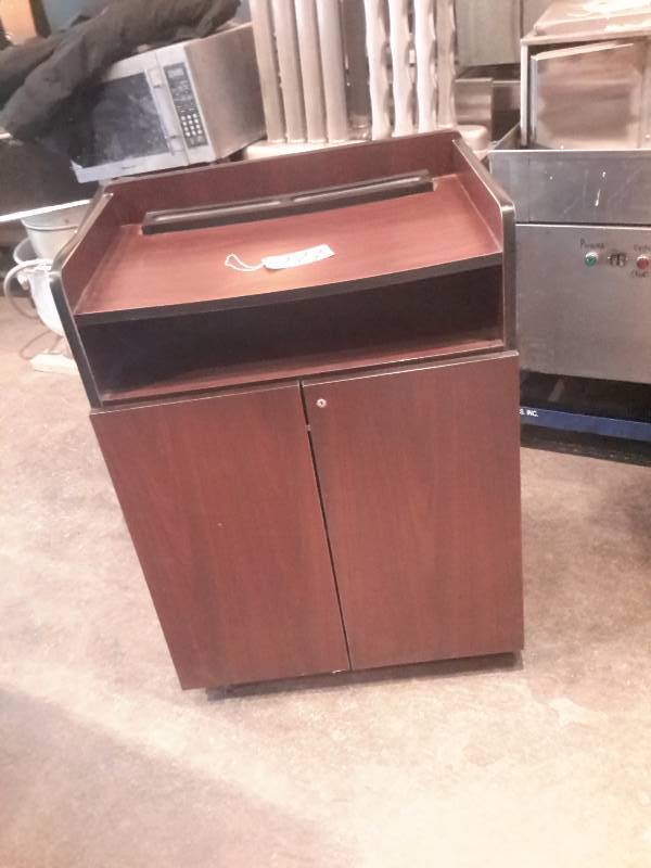 lot 222 image: Podium StandServing Station.. 30 in x 20 in x 40 in.  Simulated wood, Cherry.