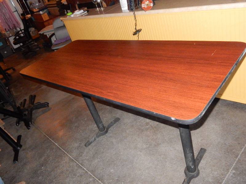 lot 181 image: Cherry Wood Venere  and black edge Table with two pedestals  30in x 72in x 42in tall.   This is an example.. All have some scratches but none real bad.