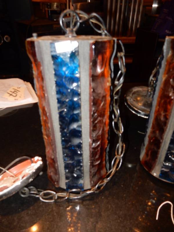 lot 149 image: 3 Heavythick Colored Glass, 1960s1970s Spanish Motifhanging light fixtures. Single bulb.  6in diameter x 12 in with 27 in chain.