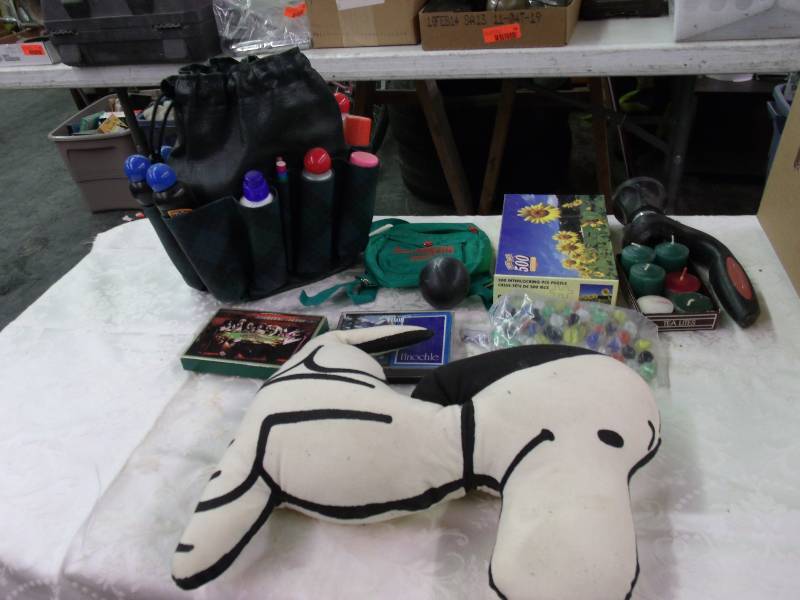 bingo bag, hose nozzle, puzzle, marbles and snoopy doll
