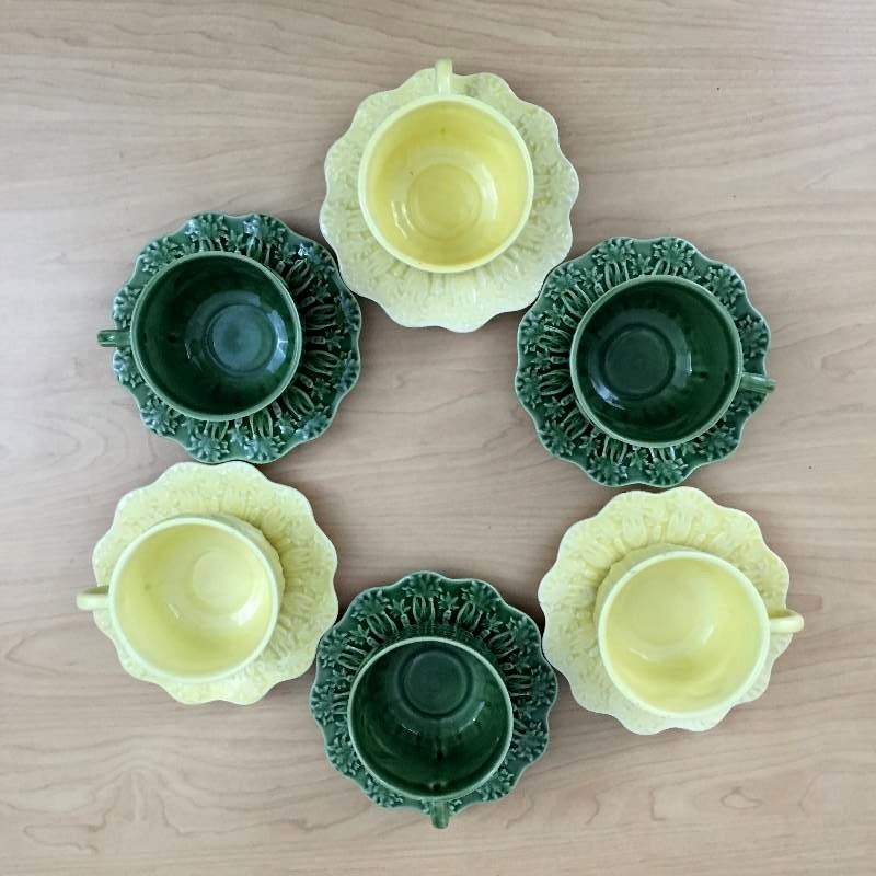 lot 57 image: 12 Piece Set Highly Collectible BORDALLO PINHEIRO Green & Yellow Embossed Easter Bunny Rabbit 6 Cups & 6 Saucers Portugal The Coelhos Collection - No Chips  Yellow cups show wear on edge.
