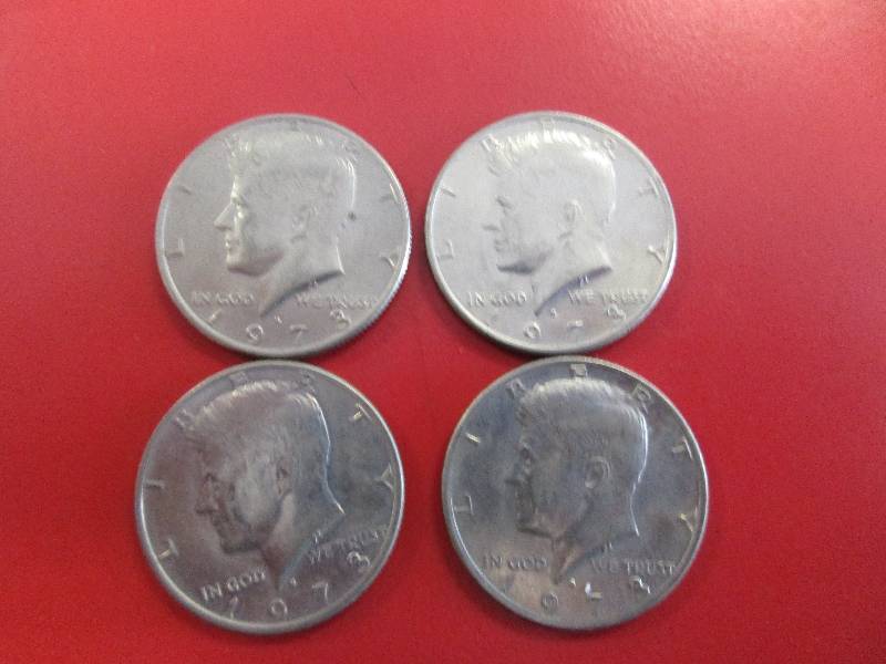 lot 37 image: Lot of (4) Kennedy Half Dollars