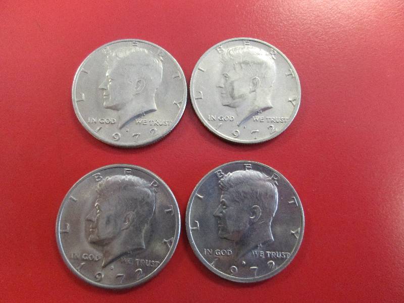 lot 49 image: Lot of (4) Kennedy Half Dollars