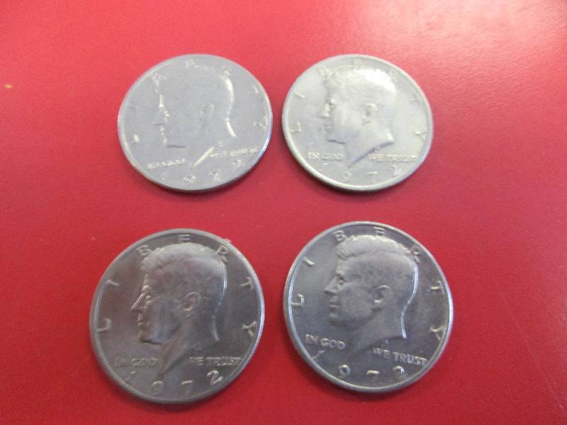 lot 50 image: Lot of (4) Kennedy Half Dollars