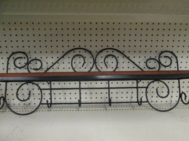 Rot iron and wood shelf with coat r...