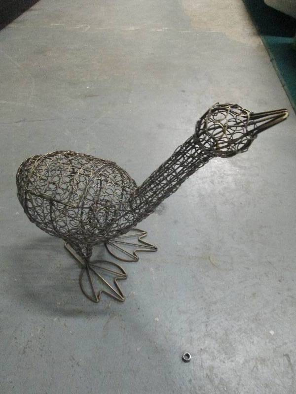 Metal Bird with opening door on sid...