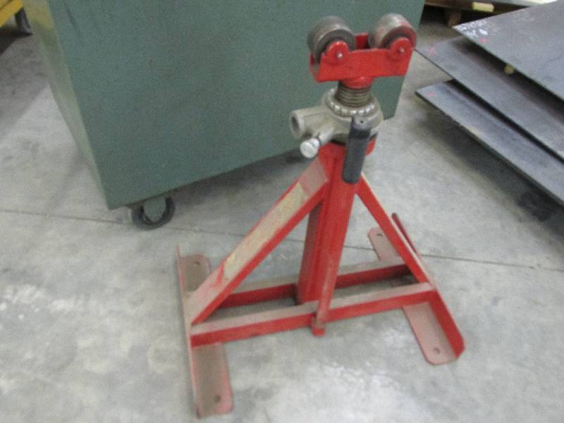 Equipment lift with rollers on top,...