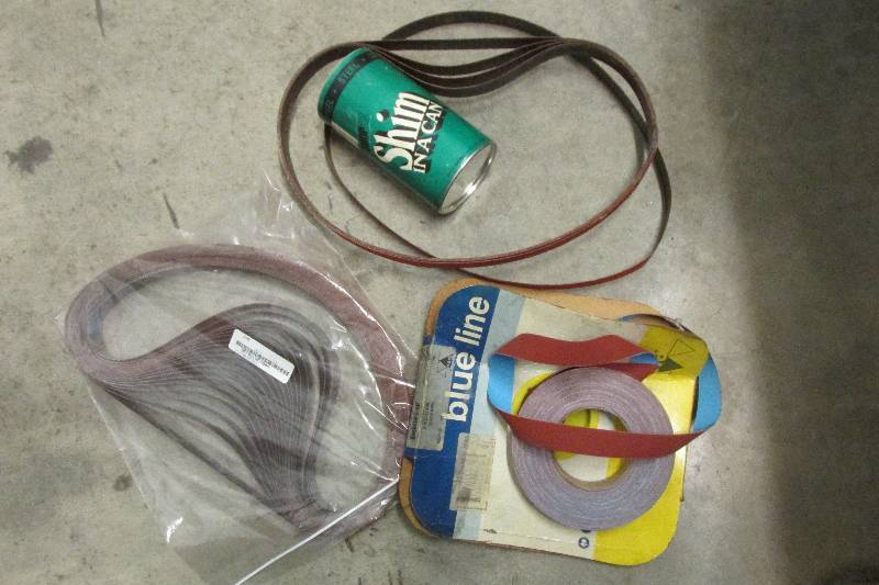 Lot of sanding belts and shop shim...