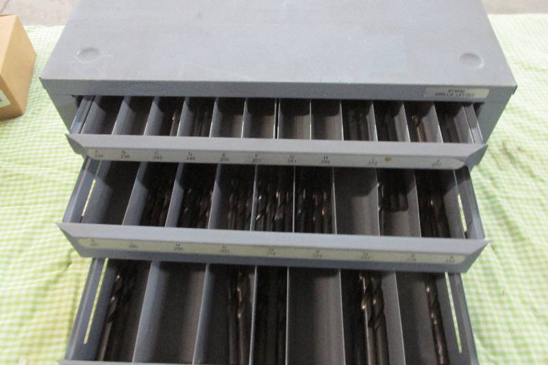 Metal bin filled with drill bits...