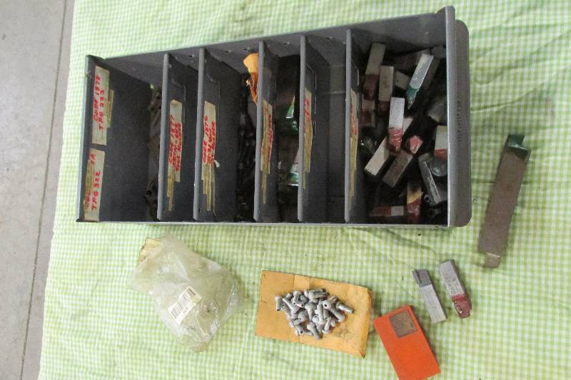 Bin of Kendex holders and machine p...