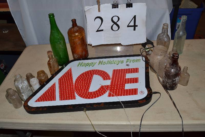 lot 284 image: Ace Sign and Bottles